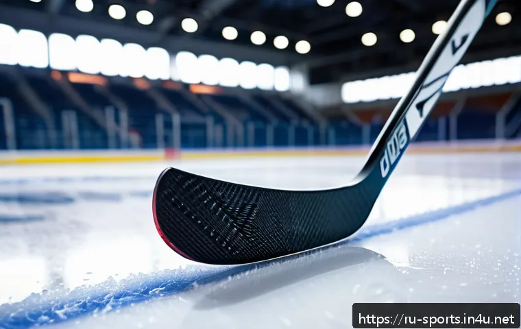 아이스하키 스틱 고르는 법 - A modern composite hockey stick leaning against the boards of an ice rink, featuring detailed textur...